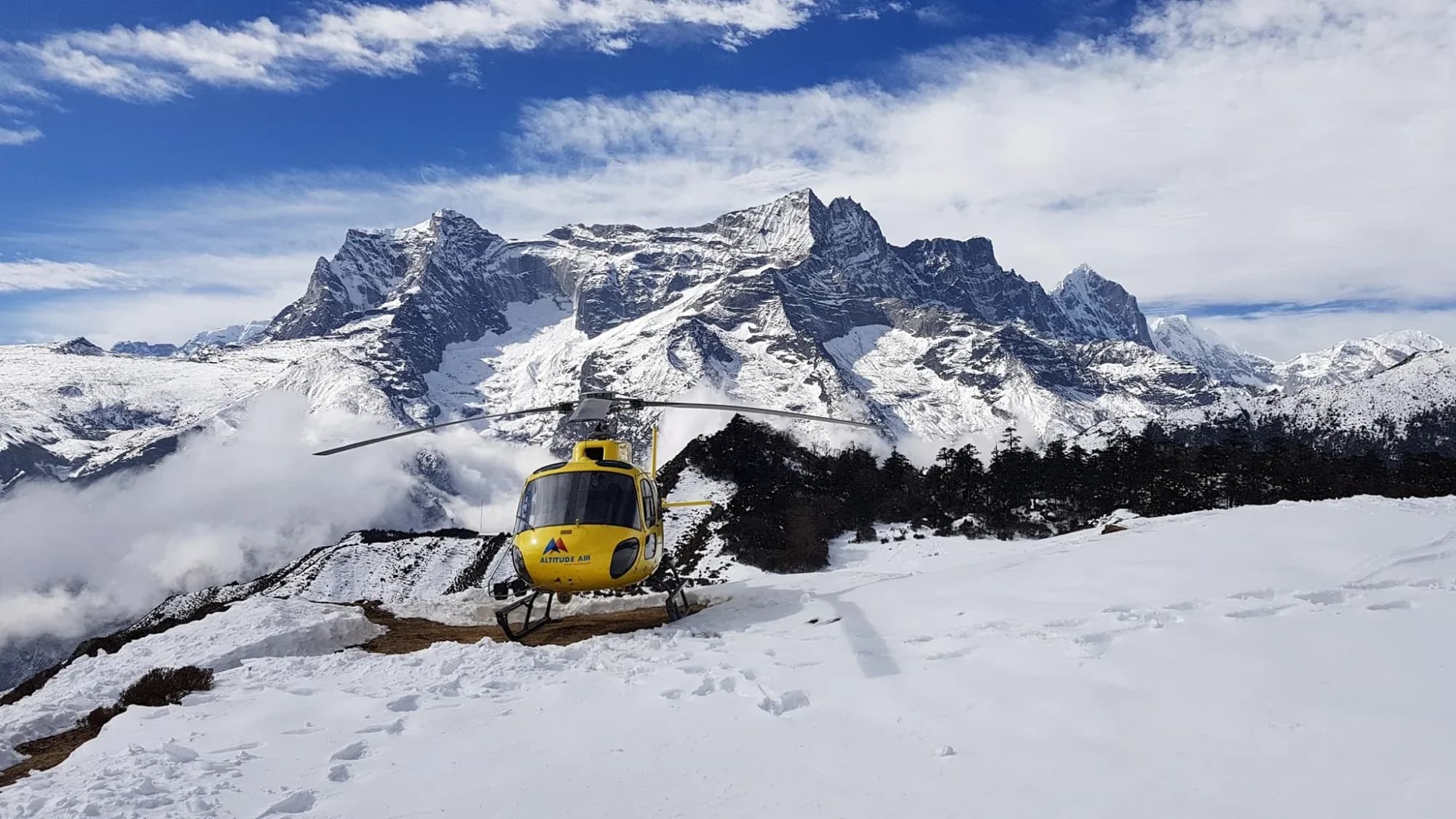 A helicopter landed on the snow above Gokyo