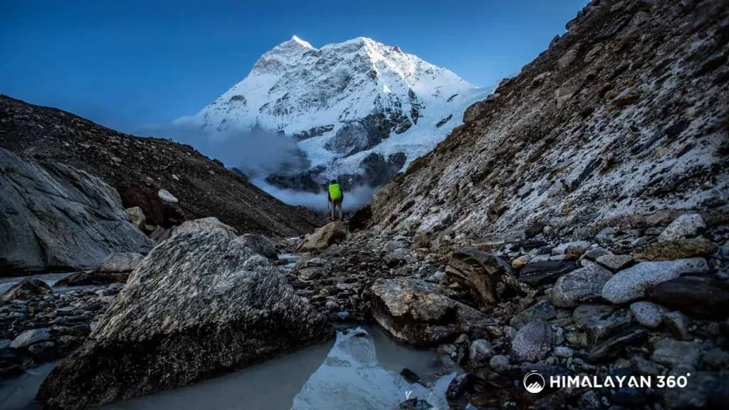 Trekker in Barun gorge below towering Mount Makalu
