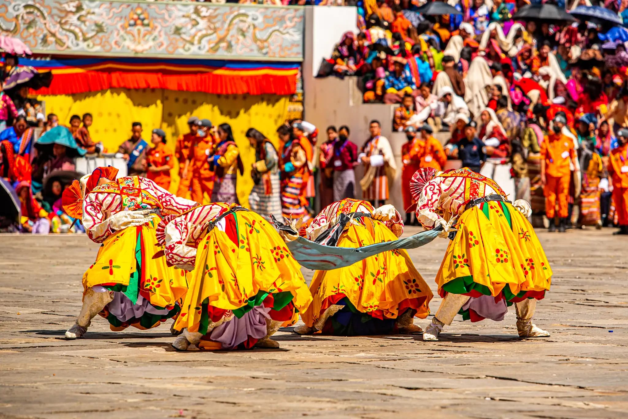 Dancers in costume at the Paro Tshechu festival in Bhutan