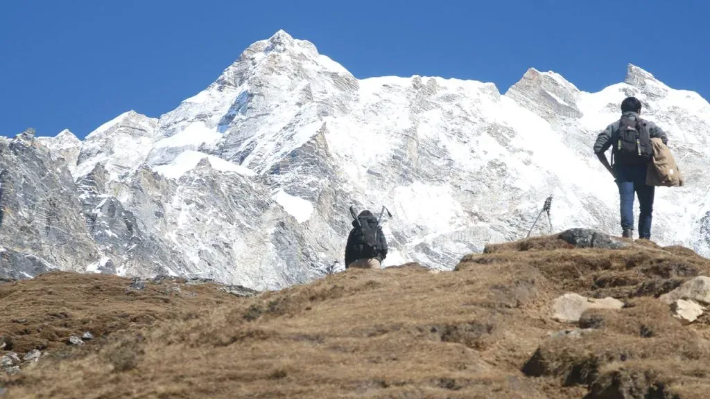 Trekkers on the Langtang trail below the snow line