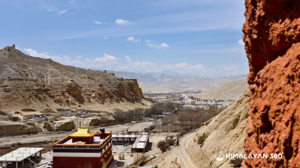Eroded cliffs and cave dwellings above the Upper Mustang trail